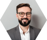 close-up-portrait-caucasian-unshaved-man-eyeglasses-looking-camera-with-sincere-smile-isolated-gray
